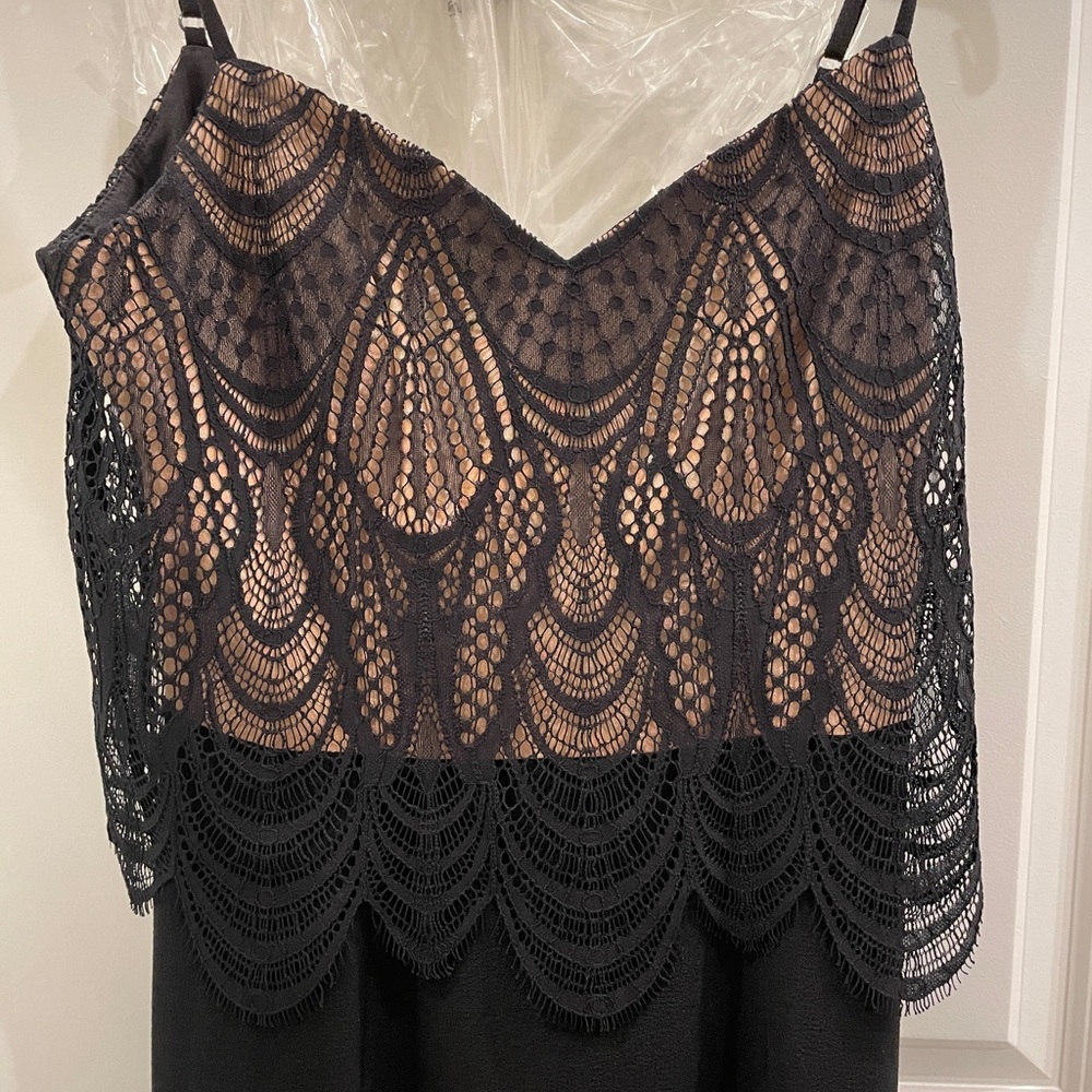 *Price Drop* New with tags Black, nude Dress the Population gown.Never worn. XS.